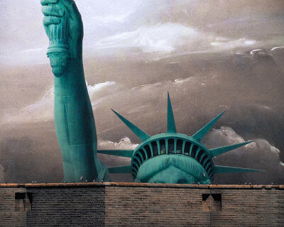 no-to-scale imagines a huge wall around lady liberty to remind us what she stands for