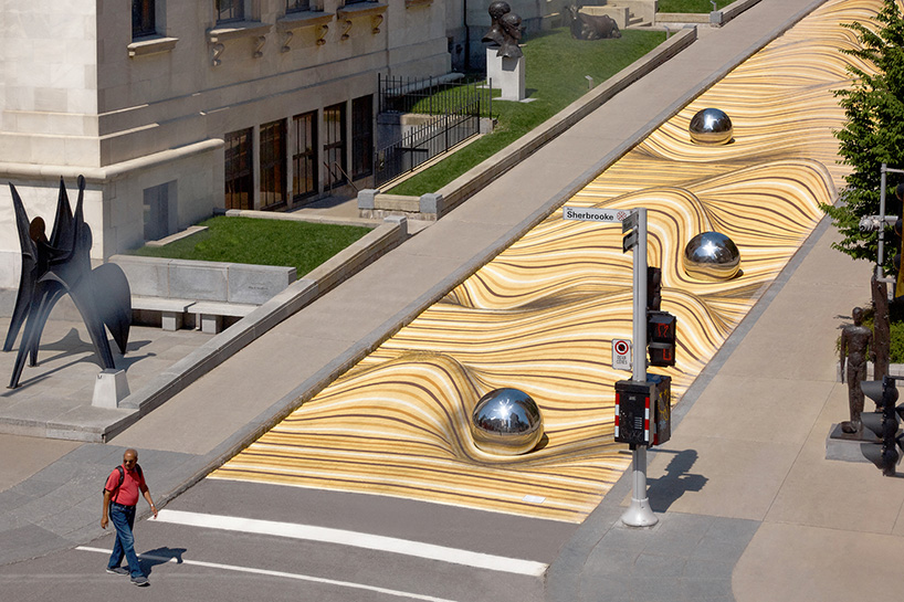 moving dunes by NÓS is a large-scale mural in montreal that seems to warp the street