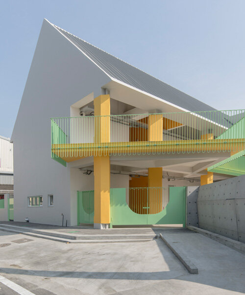 bright yellow columns complete ospacearchitects' tung yuan kindergarten in taiwan