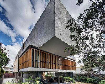 overhanging concrete volumes & wooden lattice complete 'bacatete house' in mexico