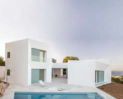 'patio house' by nomo studio offers unobstructed sea views in menorca, spain