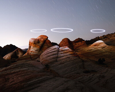 reuben wu uses drones to illuminate utah's erosional landscapes in light storm series
