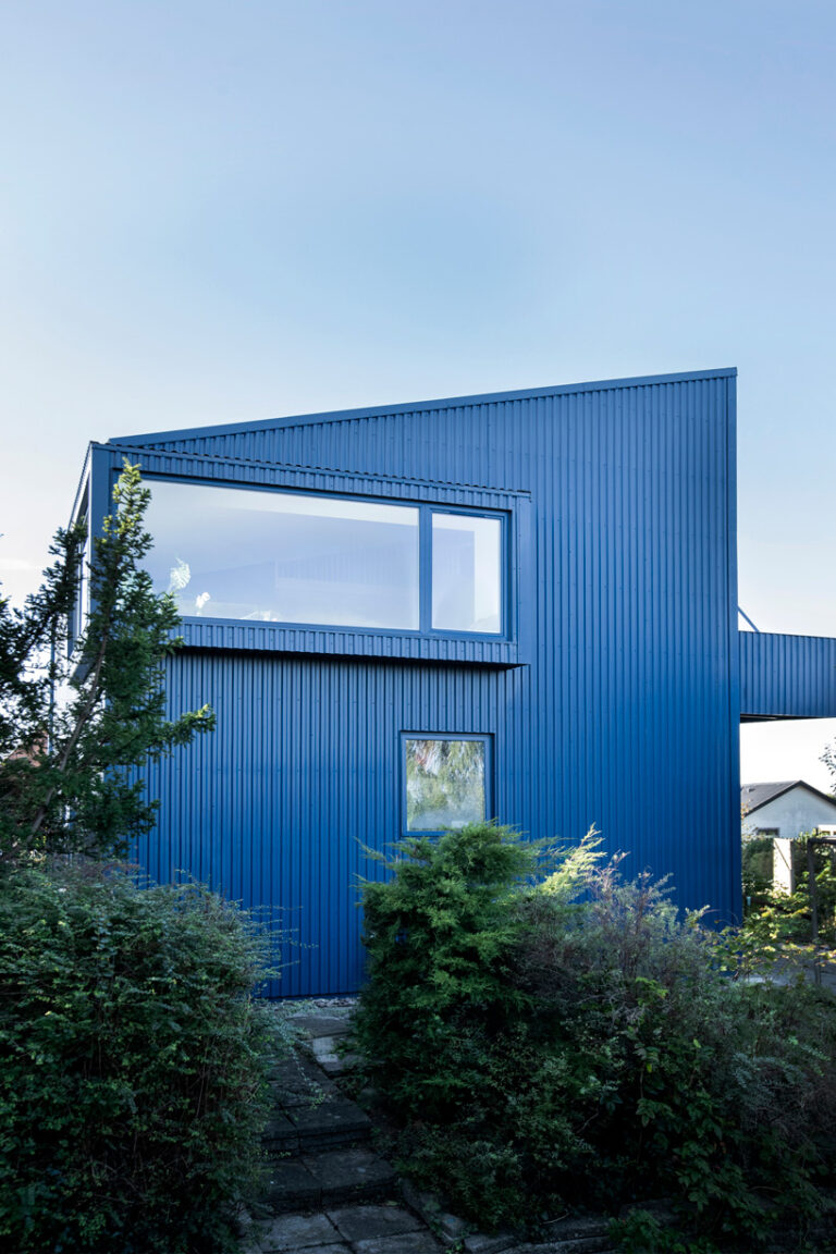 sigurd larsen clads monolithic danish house in blue corrugated steel