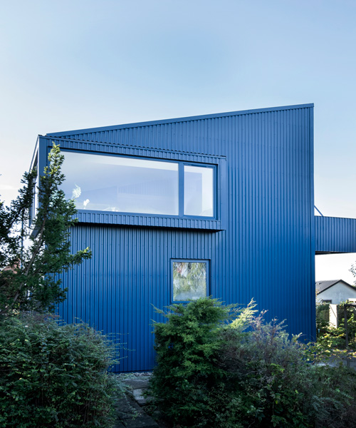 sigurd larsen clads monolithic danish house in blue corrugated steel