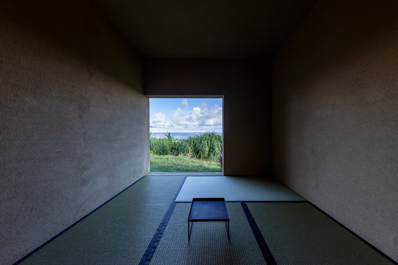 studio cochi architects' concrete house opens toward the lush landscape of okinawa island
