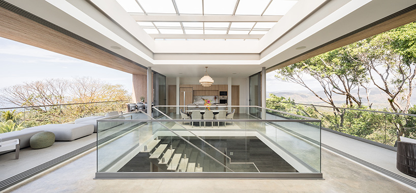 'atrium house' by studio saxe offers jungle and ocean views from a costa rica hilltop