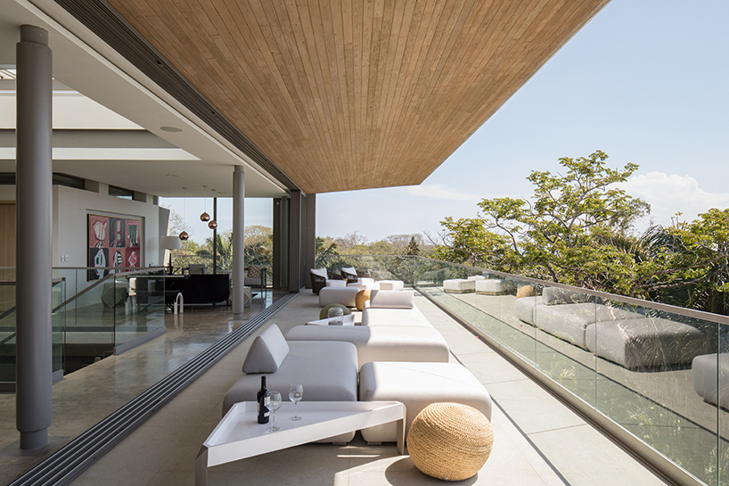 'atrium house' by studio saxe offers jungle and ocean views from a costa rica hilltop