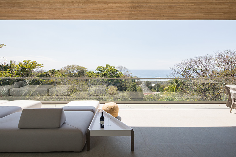'atrium house' by studio saxe offers jungle and ocean views from a costa rica hilltop