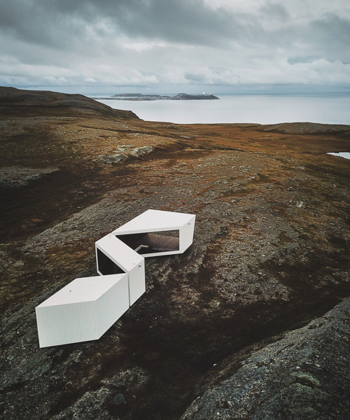 a timber-clad viewpoint designed by biotope opens in norway's arctic landscape