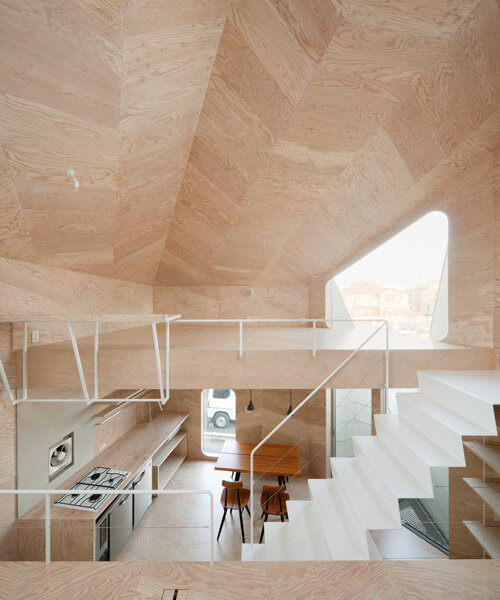 yoshinori sakano architects divides tiny tokyo house into seven split levels clad in plywood