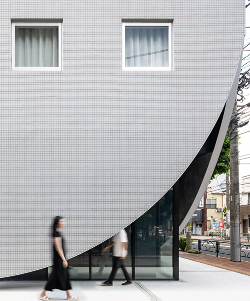 floating concrete façade wraps YSLA architects' 'lighthouse' residential building in tokyo