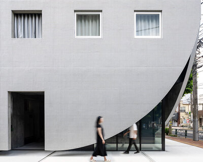 floating concrete façade wraps YSLA architects' 'lighthouse' residential building in tokyo
