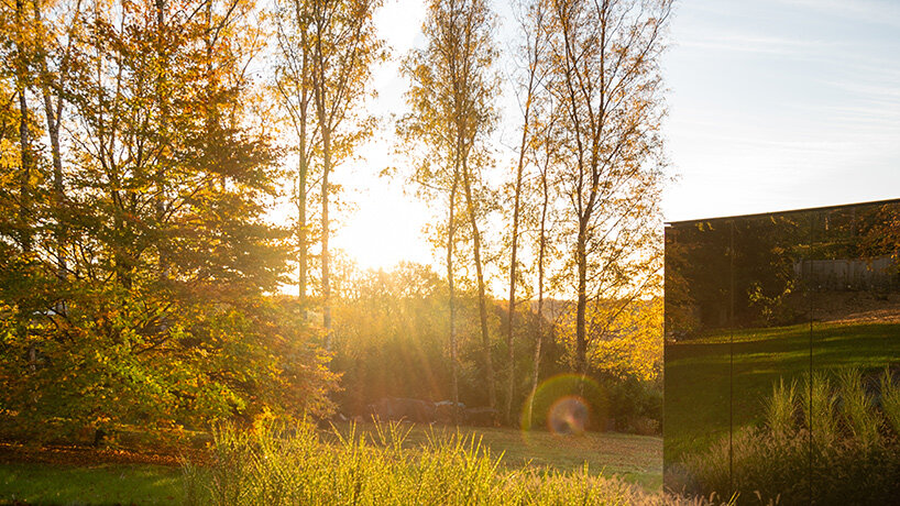 MIA architecture constructs mirror-clad volume to house its office near liège