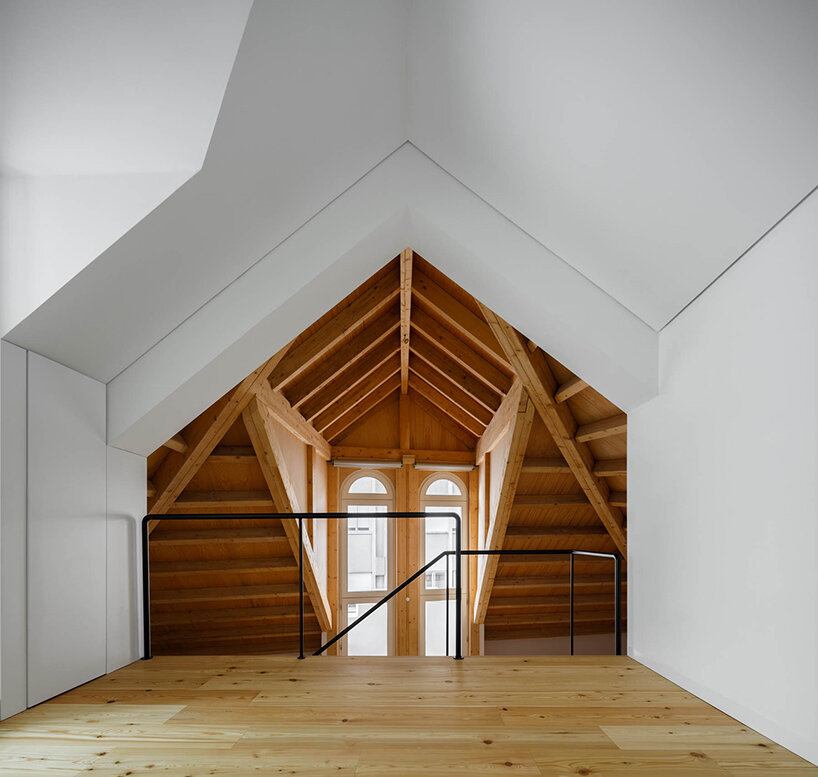 anarchlab transforms historic stone warehouse in porto with renovated dwellings