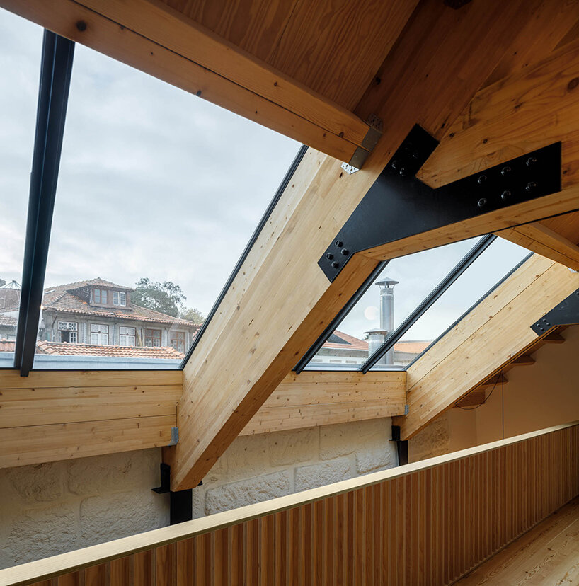 anarchlab transforms historic stone warehouse in porto with renovated dwellings