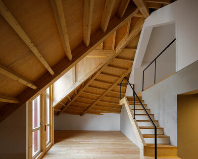 anarchlab transforms historic stone warehouse in porto with renovated dwellings