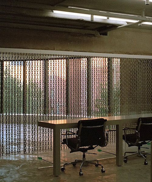 archive uses steel chain curtain partitions to organize office space in shanghai