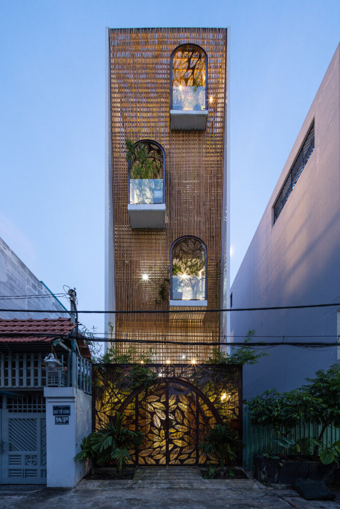 woven bamboo façade clads atelier ngng's 'floating nest' house in vietnam