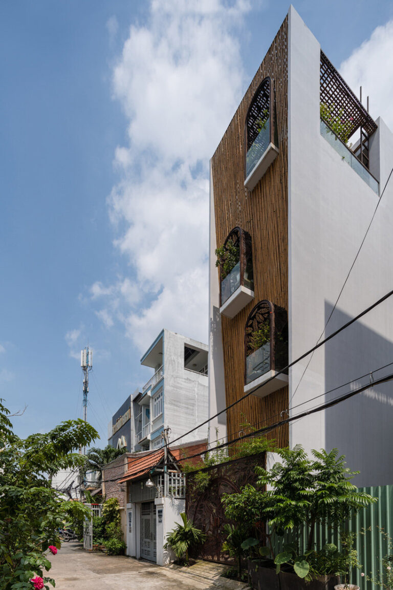 woven bamboo façade clads atelier ngng's 'floating nest' house in vietnam