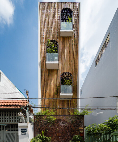 woven bamboo façade clads atelier ngng's 'floating nest' house in vietnam