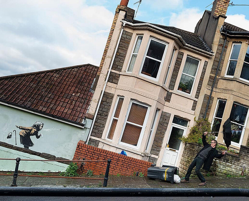 banksy surprises with woman sneezing mural in hometown bristol
