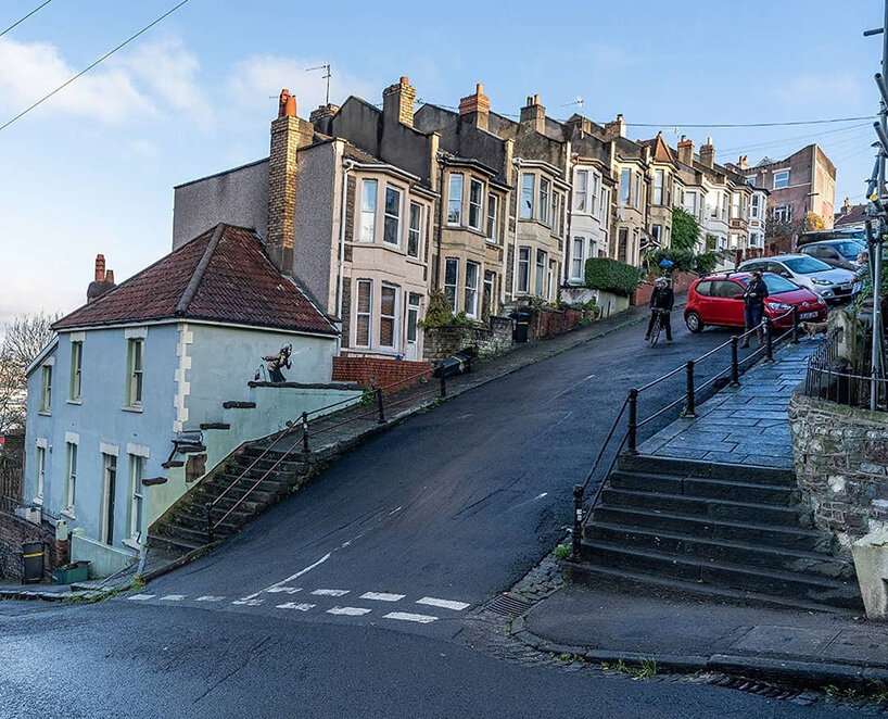 banksy surprises with woman sneezing mural in hometown bristol