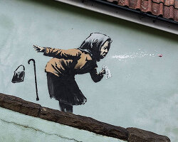 banksy surprises with woman sneezing mural in hometown bristol