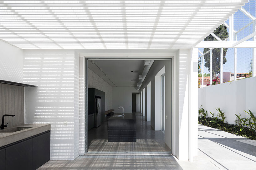 lightweight rib envelope clads patio in buenos aires residence by BHY arquitectos
