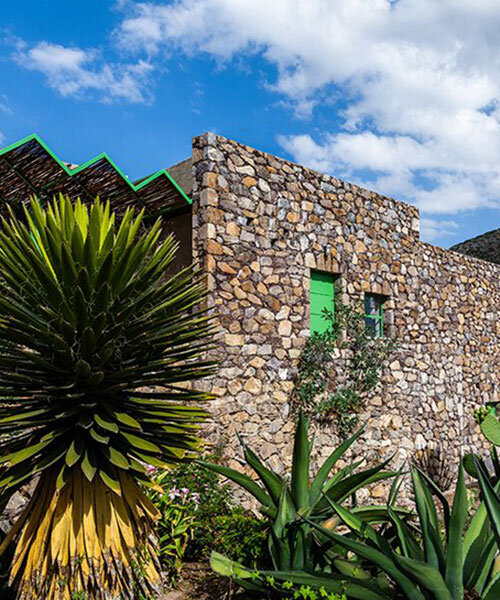 'casa georgina' by departamento del distrito sits within stonewalled garden in mexico
