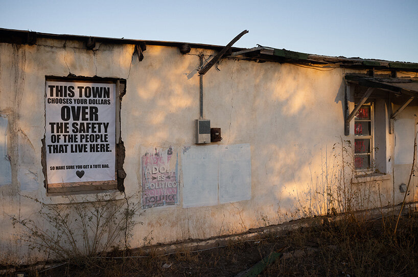 chris ramming and rob brill install ‘everyone hates you’ neon sign in marfa, texas