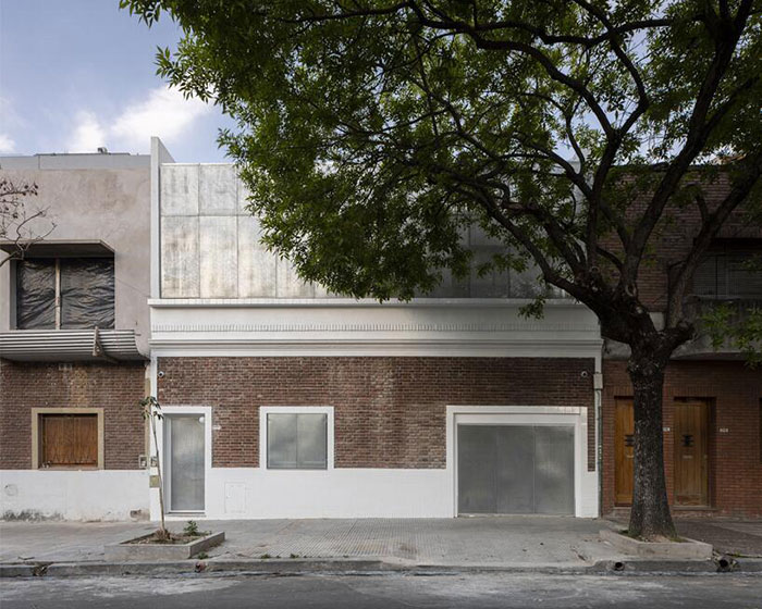 estudio florida extends house in buenos aires with brick, ceramic tiles and perforated metal