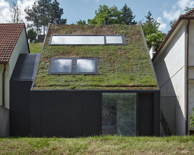 in the czech village of znojmo, kuba & pilar architekti introduces a residential wall of green