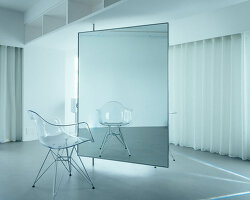 large floating mirror captures urban views within private salon by 2nf+ in tokyo