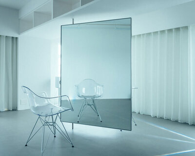 large floating mirror captures urban views within private salon by 2nf+ in tokyo