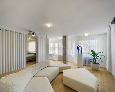 laura ortín arquitectura installs curved partitions within residential refurbishment in spain