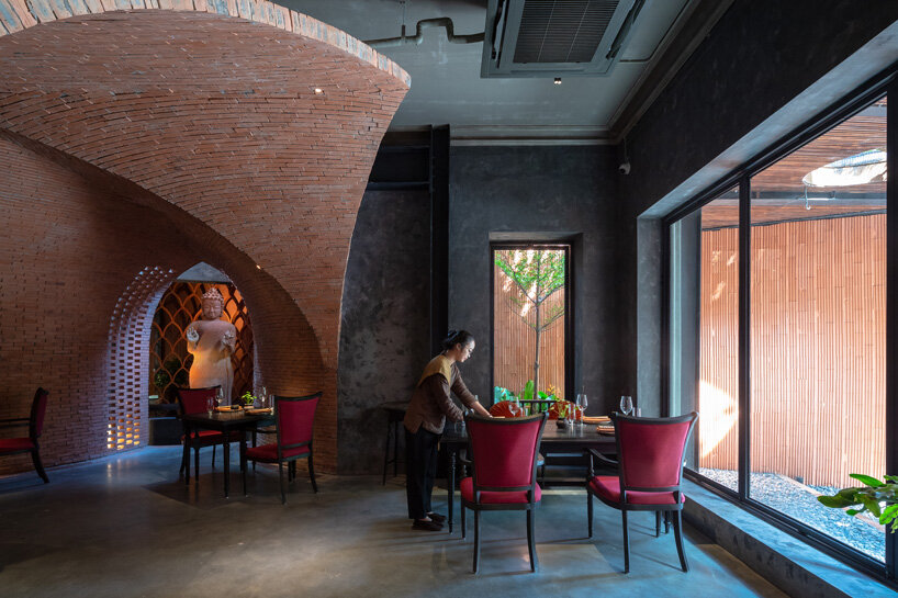 le house designs vegetarian restaurant in vietnam to resemble a champa red brick temple