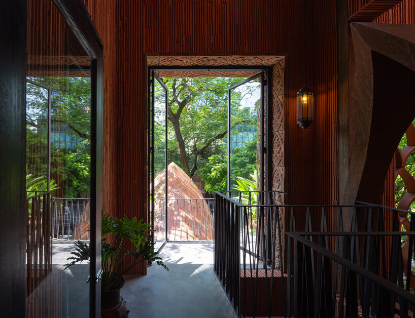 le house designs vegetarian restaurant in vietnam to resemble a champa red brick temple