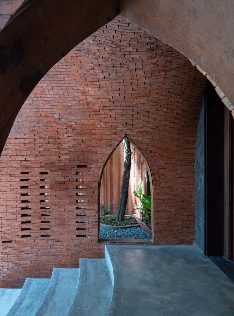 le house designs vegetarian restaurant in vietnam to resemble a champa red brick temple