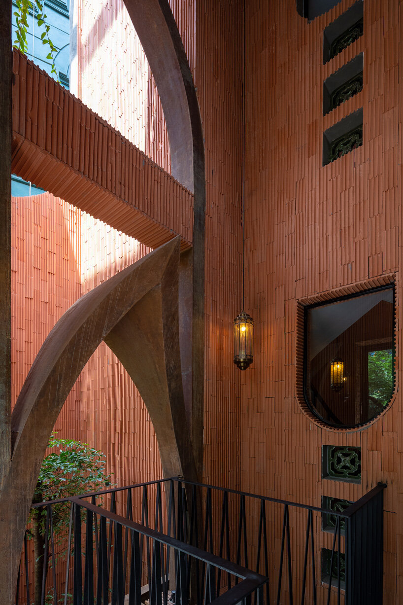 le house designs vegetarian restaurant in vietnam to resemble a champa red brick temple