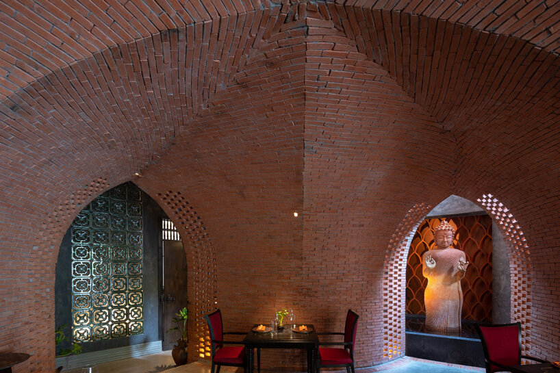 le house designs vegetarian restaurant in vietnam to resemble a champa red brick temple