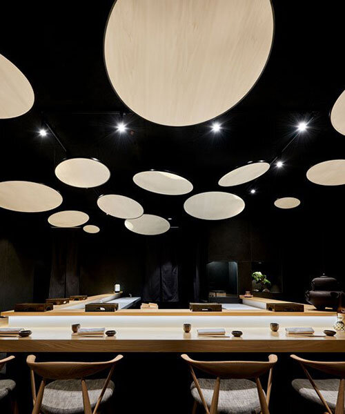mikiya kobayashi installs ceiling full of 'suns' within sushi bar in valencia, spain