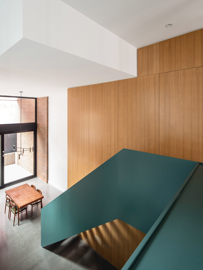 naturehumaine adds metal-clad extension to victorian house renovation in canada