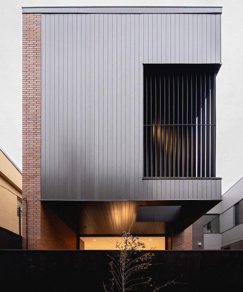 naturehumaine adds metal-clad extension to victorian house renovation in canada