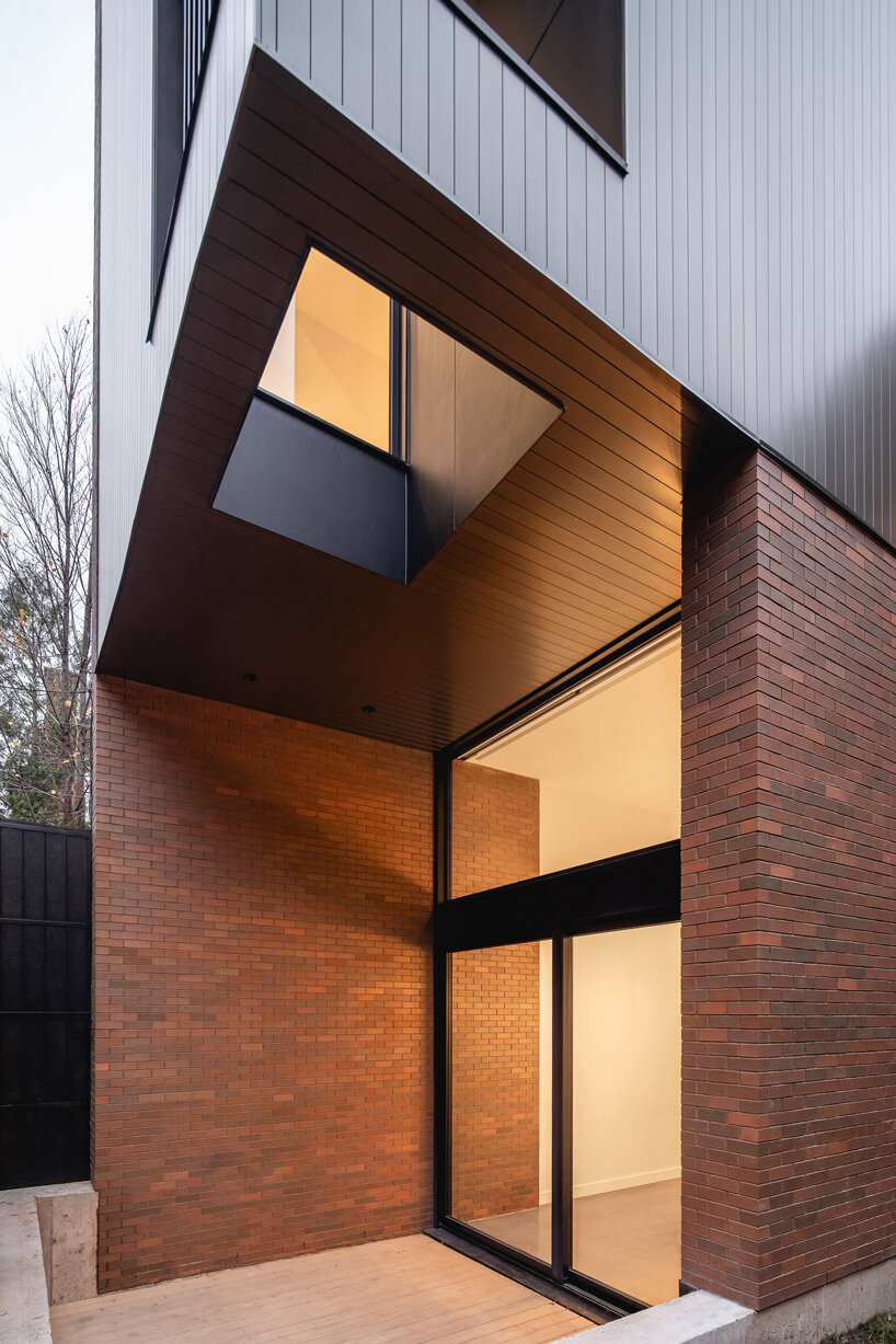 naturehumaine adds metal-clad extension to victorian house renovation in canada