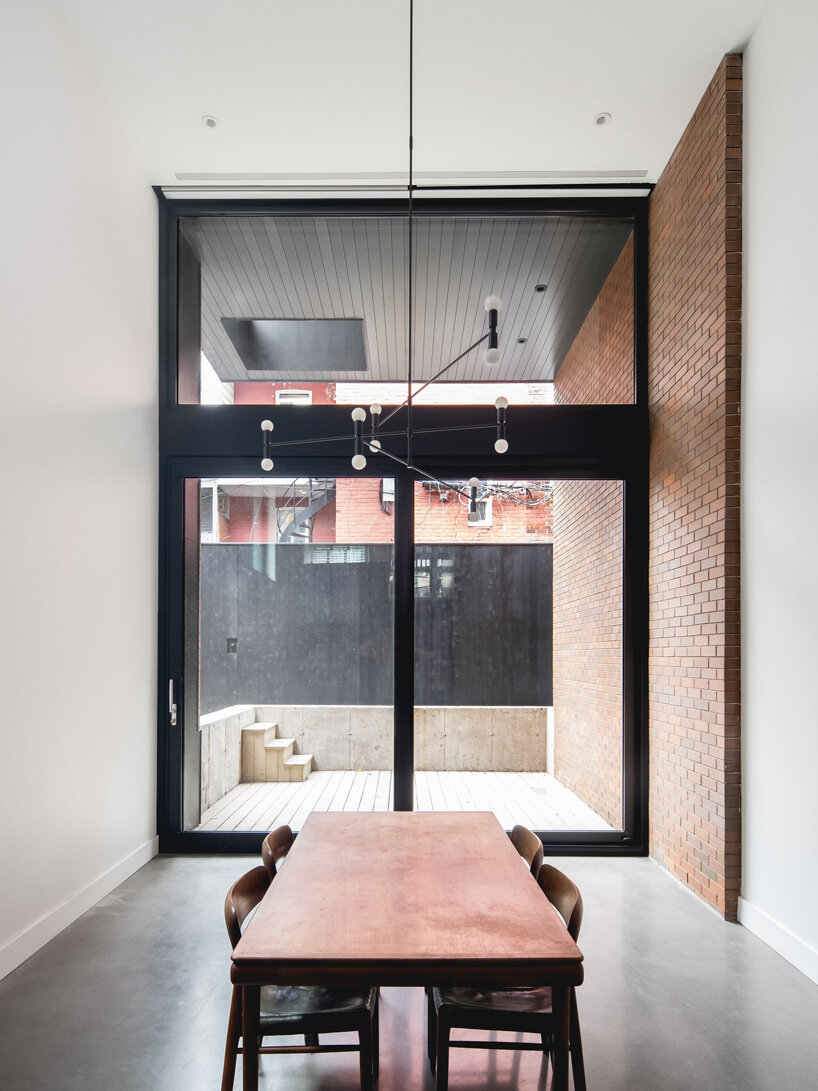 naturehumaine adds metal-clad extension to victorian house renovation in canada