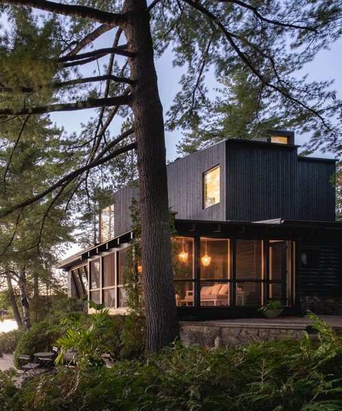 paul bernier architecte tops rustic log cabin in canada with monolithic wood-clad extension