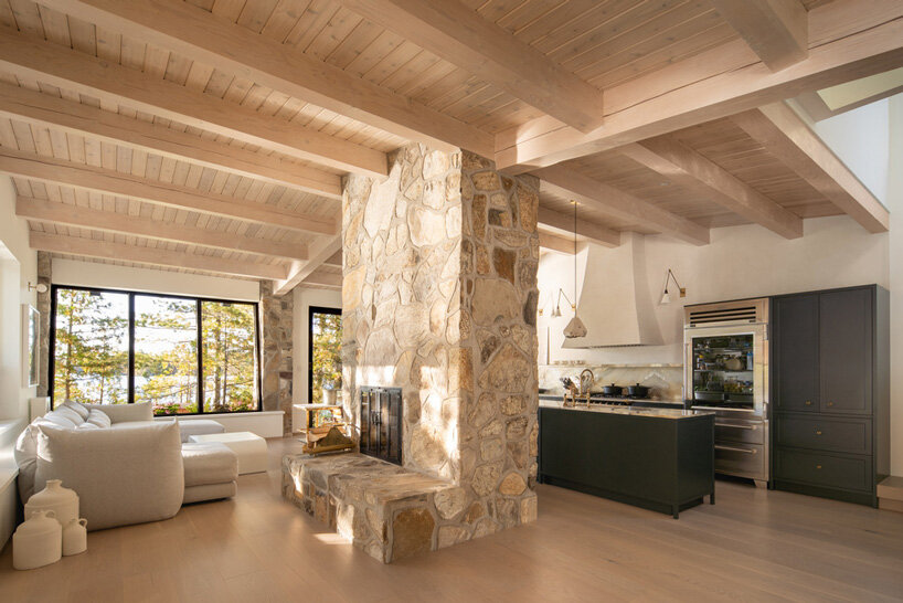 paul bernier architecte tops rustic log cabin in canada with monolithic wood-clad extension