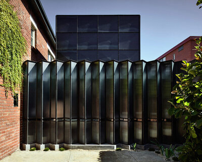 robert simeoni architects inserts pleated glass windows to powell street house in australia