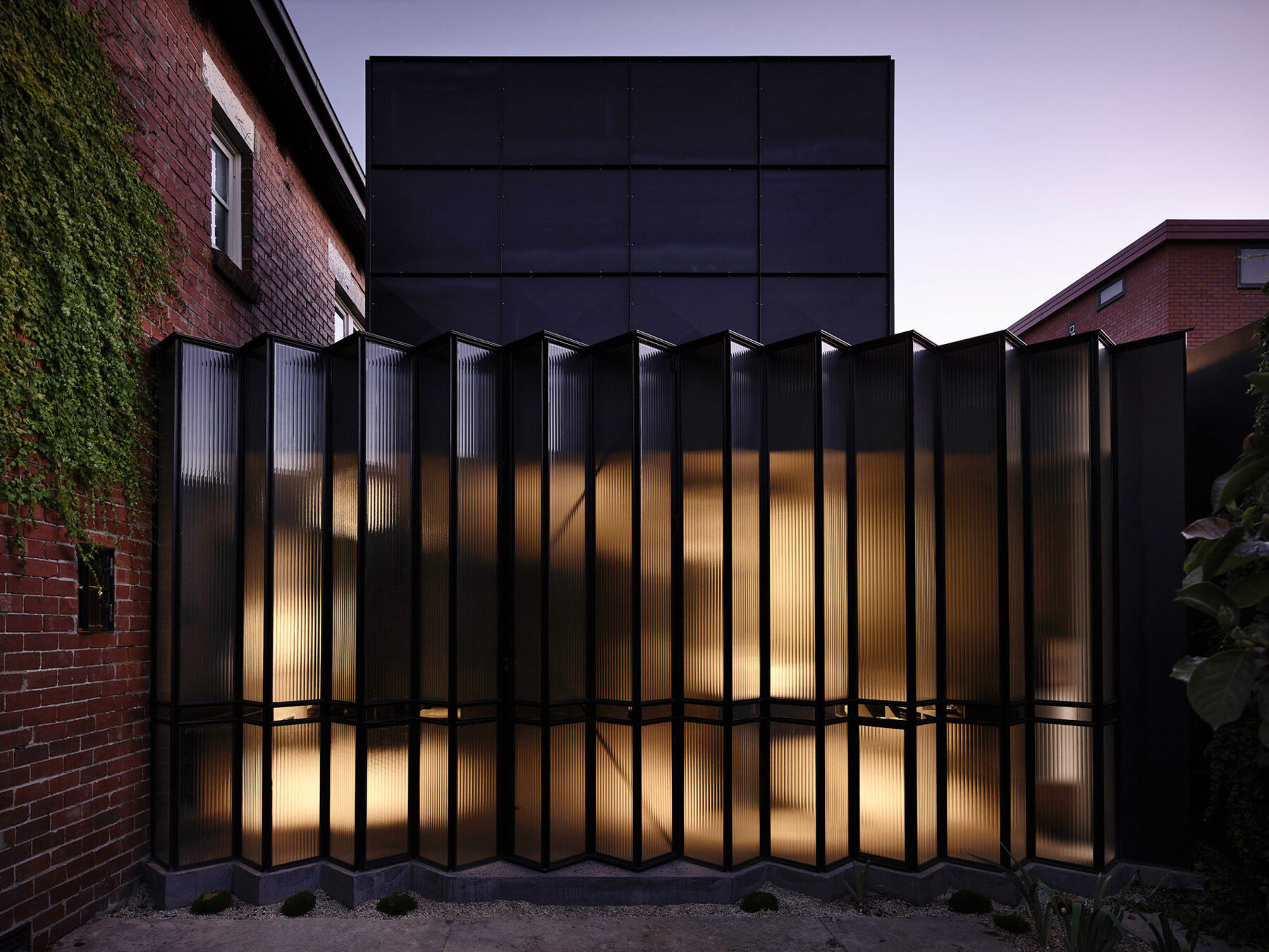 robert simeoni architects inserts pleated glass windows to powell street house in australia