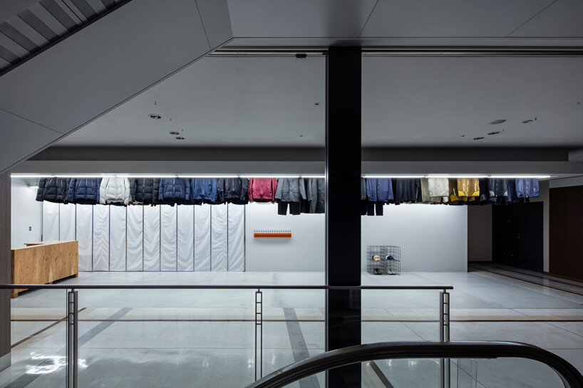schemata architects completes 'descente blanc' store in sapporo with movable hanger system